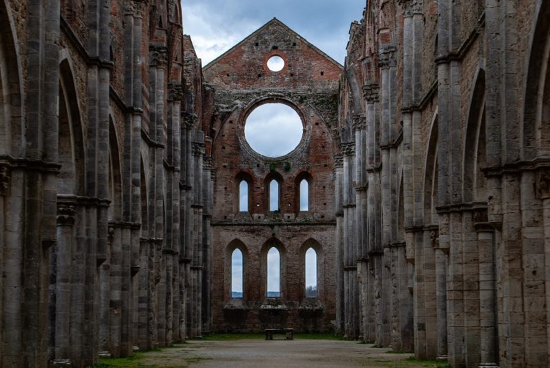 The interiors of the roofless San Galgano Abbey in Tuscany