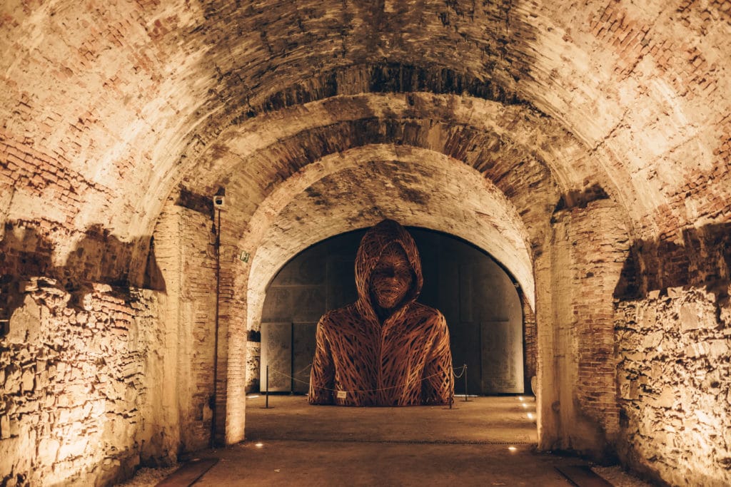 the wooden sculpture in the underground of the walls of lucca
